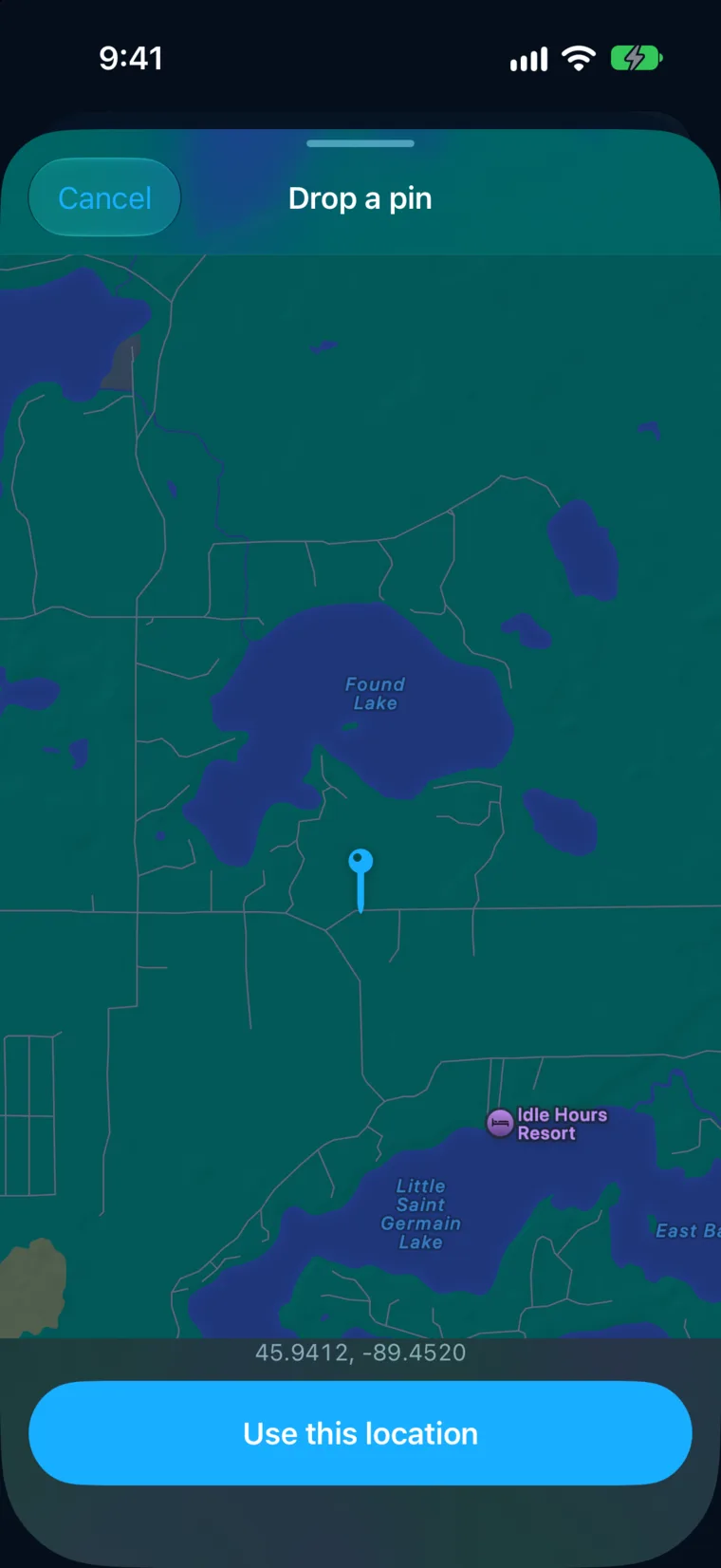 WeatherAlarm’s Drop a pin screen over lake country in northern Wisconsin: unnamed roads between Found Lake and Little Saint Germain Lake, a pin placed on a spot with no street address, and its coordinates shown above a Use this location button.